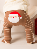 Santa Ho Ho Ho Leggings worn by a baby, showing the fluffy Santa on the seat panel above brown and cream stripes