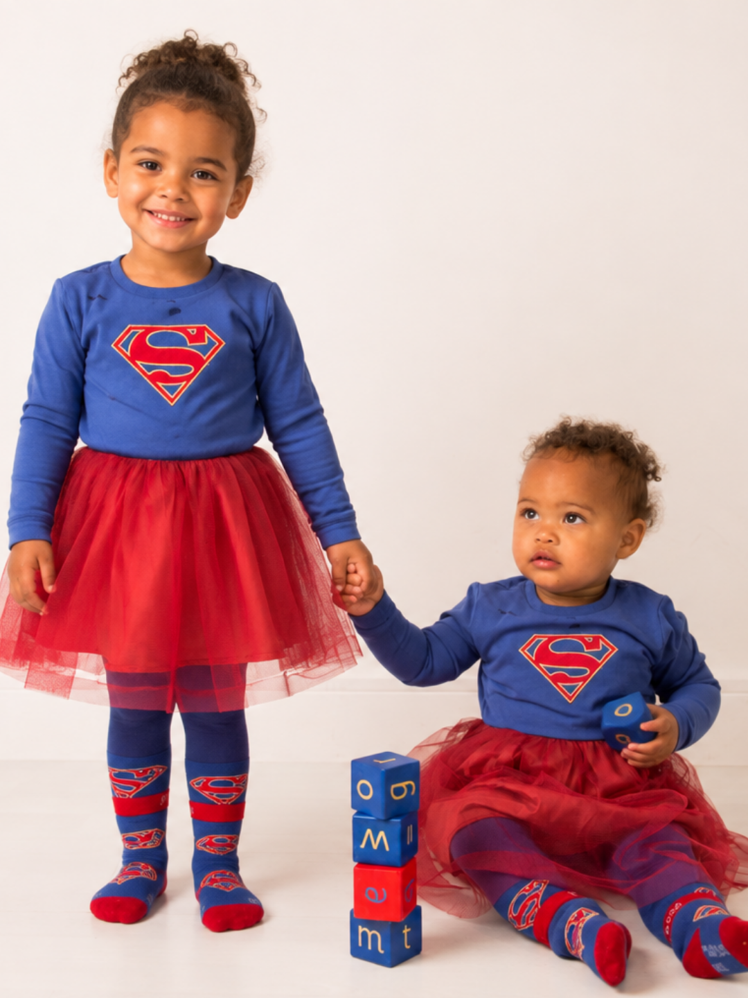 Two children wearing the Supergirl™ Unstoppable range