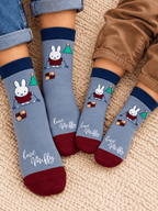 Miffy™ Christmas Socks worn by an adult and a child together, blue with Miffy on her skis